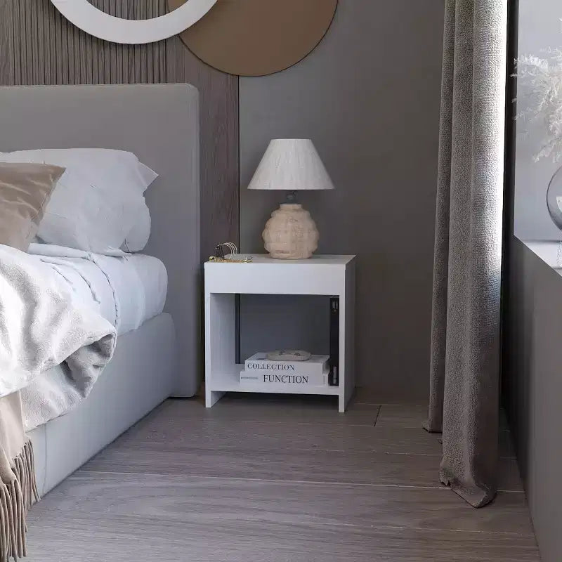This Anegam Nightstand with Open Storage, White combines contemporary style with smart storage solutions, creating a space saving furniture.